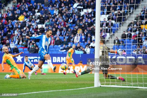 Martin Braithwaite of RCD Espanyol scores the team's first goal as Claudio Bravo of Real Betis attempts to make a save during the LaLiga Santander...