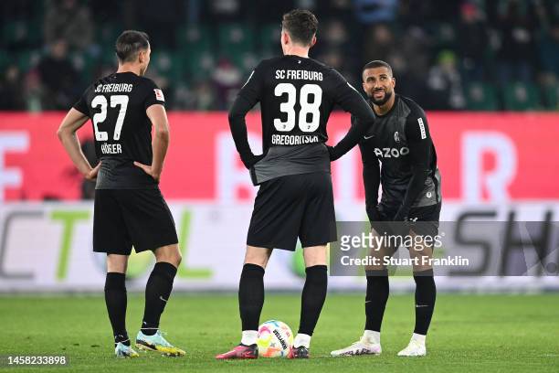 Nicolas Hoefler, Michael Gregoritsch and Daniel-Kofi Kyereh of SC Freiburg looks dejected during the Bundesliga match between VfL Wolfsburg and...