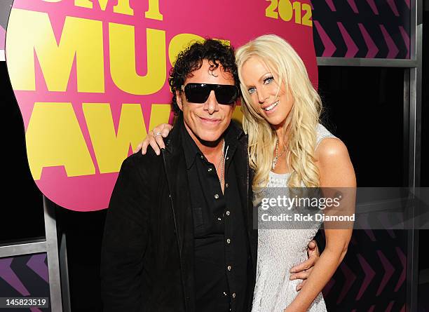 Musician Neal Schon and Michaele Salahi arrive at the 2012 CMT Music awards at the Bridgestone Arena on June 6, 2012 in Nashville, Tennessee.