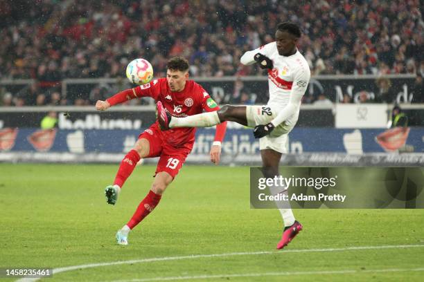 Anthony Caci of 1.FSV Mainz 05 is challenged by Naouirou Ahamada of VfB Stuttgart during the Bundesliga match between VfB Stuttgart and 1. FSV Mainz...