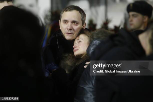 People grieve at a funeral ceremony for victims of a helicopter crash on January 21, 2023 in Kyiv, Ukraine. A funeral ceremony for the leadership of...