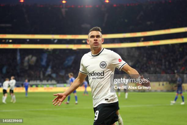 Rafael Santos Borre of Eintracht Frankfurt celebrates after Aurelio Buta scores the team's third goal during the Bundesliga match between Eintracht...