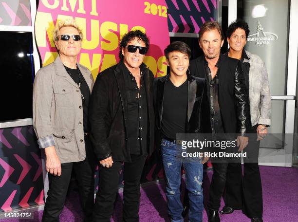 Journey members Ross Valory, Neal Schon, Arnel Pineda, Jonathan Cain, and Deen Castronovo arrive at the 2012 CMT Music awards at the Bridgestone...