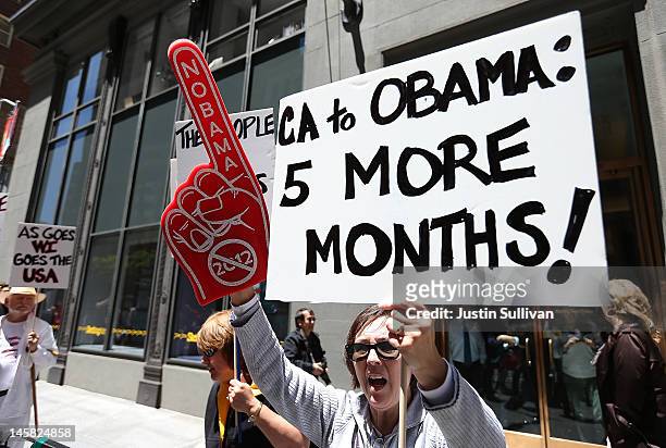 Tea Party protester holds a sign during a demonstration outside of a fundraiser for U.S. President Barack Obama on June 6, 2012 in San Francisco,...