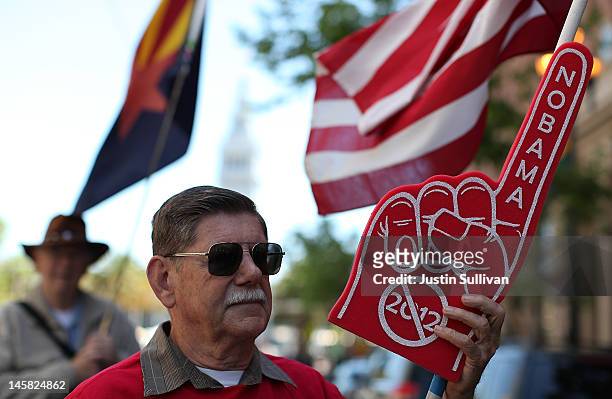 Tea Party protester holds a sign during a demonstration outside of a fundraiser for U.S. President Barack Obama on June 6, 2012 in San Francisco,...