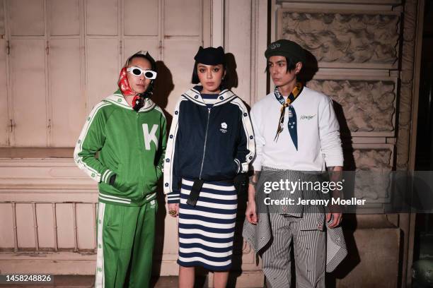 Kiwi Lee Han and Fashion Week Guests attends the Kenzo Menswear Fall-Winter 2023-2024 show as part of Paris Fashion Week, seen wearing a blue and...