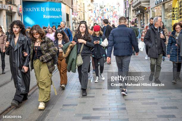 people walking on istiklal avenue in istanbul, turkey - istiklal avenue stock pictures, royalty-free photos & images
