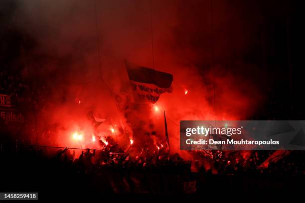 Werder Bremen fans show their support with flares during the Bundesliga match between 1. FC Köln and SV Werder Bremen at RheinEnergieStadion on...