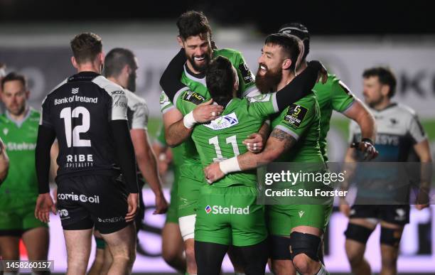 Falcons wing Mateo Carreras is congratulated by Gary Graham and Greg Peterson after scoring the third Falcons try during the Pool A Challenge Cup...