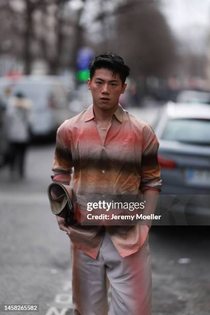 Fashion week guest seen wearing a total Paul Smith look before the Paul Smith show on January 20, 2023 in Paris, France.