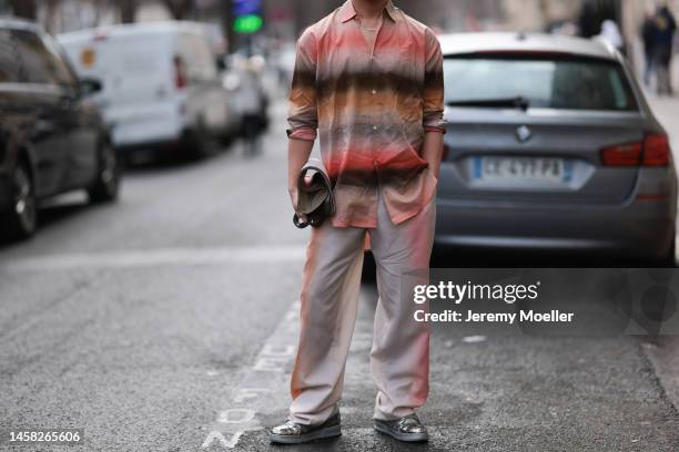 Fashion week guest seen wearing a total Paul Smith look before the Paul Smith show on January 20, 2023 in Paris, France.