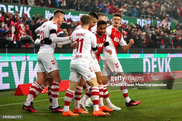Linton Maina of 1.FC Koln celebrates with teammates after scoring the team's first goal during the Bundesliga match between 1. FC Köln and SV Werder...