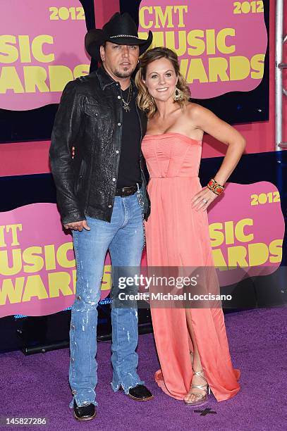 Musician Jason Aldean and wife Jessica Aldean arrive at the 2012 CMT Music awards at the Bridgestone Arena on June 6, 2012 in Nashville, Tennessee.