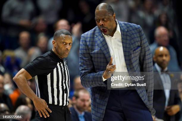 Head coach Patrick Ewing of the Georgetown Hoyas argues with referee Mike Roberts in the second half against the Xavier Musketeers at the Cintas...