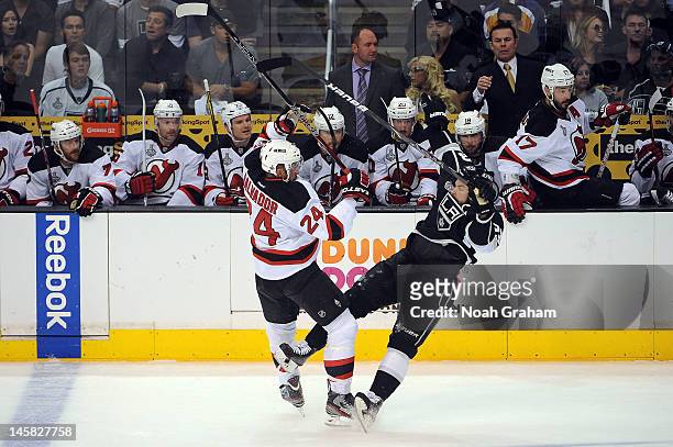 Bryce Salvador of the New Jersey Devils collides with Dustin Brown of the Los Angeles Kings in Game Four of the 2012 Stanley Cup Final at Staples...