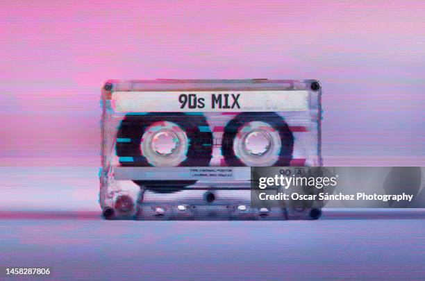 cassette audio tape with glitch vhs effect, 90s mix text on label - tape stockfoto's en -beelden