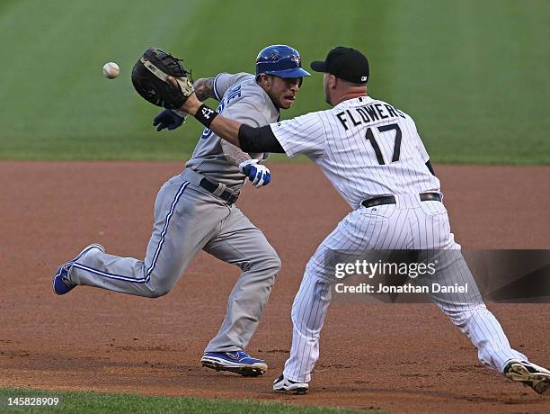 Tyler Flowers of the Chicago White Sox takes the throw on a run-down as Brett Lawrie of the Toronto Blue Jays tries to get past at U.S. Cellular...