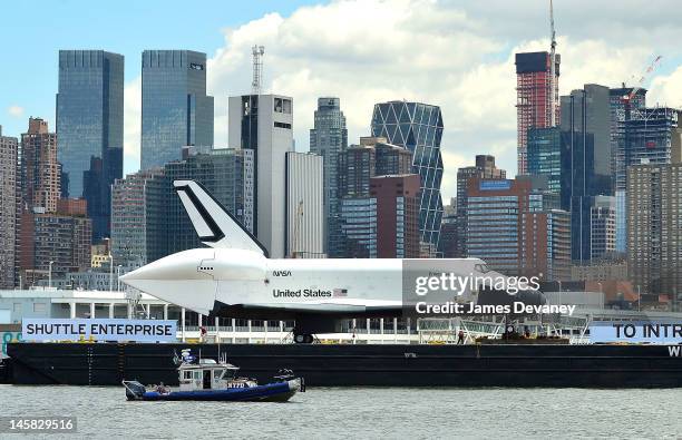 Space Shuttle Enterprise is transported to the Intrepid Sea, Air & Space Museum on June 6, 2012 in New York City.