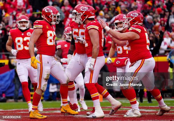 Travis Kelce of the Kansas City Chiefs celebrates with his teammates after scoring an 8 yard touchdown against the Jacksonville Jaguars during the...