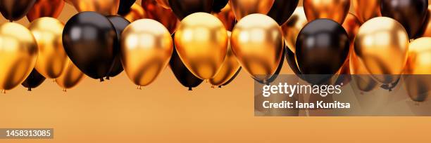 gold and black balloons on yellow background. beautiful 3d greeting backdrop, panoramic banner. - black balloon stock-fotos und bilder