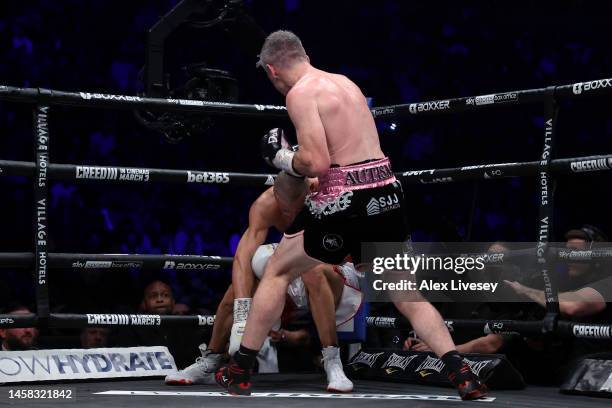 Liam Smith knocks down Chris Eubank Jr during the Middleweight fight between Chris Eubank Jr and Liam Smith at Manchester Arena on January 21, 2023...