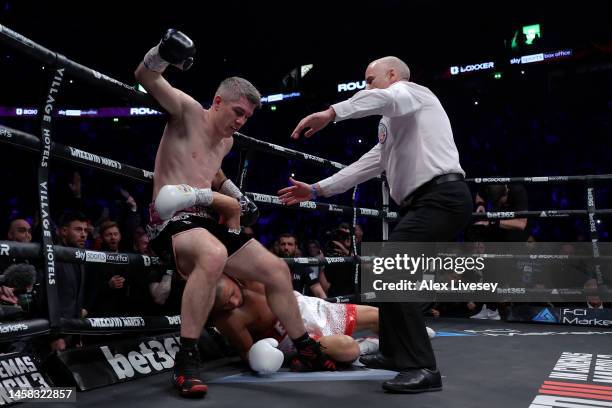 Chris Eubank Jr is knocked down for second time by Liam Smith, shortly before the Referee calls the fight, during the Middleweight fight between...