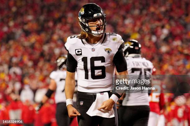 Trevor Lawrence of the Jacksonville Jaguars celebrates a touchdown scored by Travis Etienne Jr. #1 against the Kansas City Chiefs during the fourth...