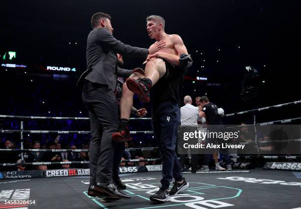 Liam Smith celebrates with promoter Ben Shalom and their coaching team as the Referee calls the fight, after Chris Eubank Jr is knocked down for a...