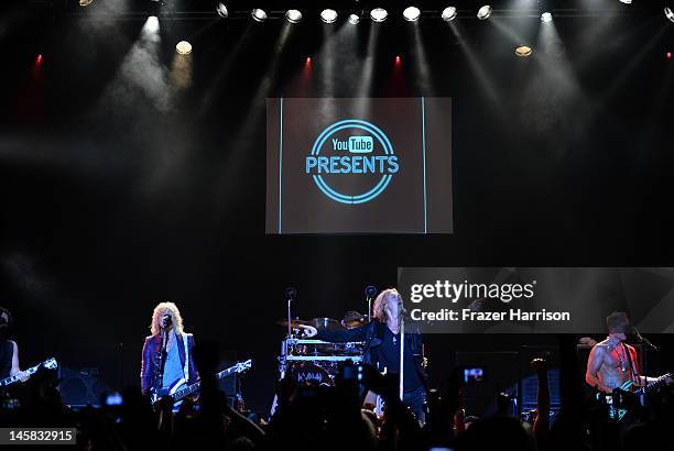 Def Leppard's Rick Savage Joe Elliott, Rick Allen, Phil Collen perform at YouTube Presents Def Leppard At The House Of Blues at House of Blues Sunset...