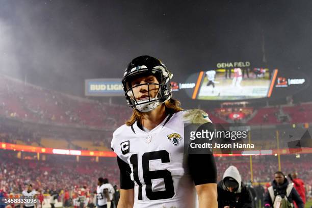 Trevor Lawrence of the Jacksonville Jaguars walks off the field after being defeated by the Kansas City Chiefs in the AFC Divisional Playoff game at...