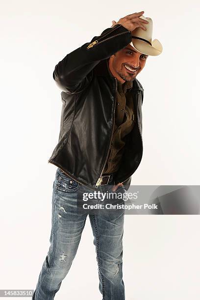 Brad Paisley poses in the Wonderwall.com.com Portrait Studio during 2012 CMT Music awards at the Bridgestone Arena on June 6, 2012 in Nashville,...