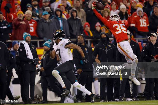 Jaylen Watson of the Kansas City Chiefs intercepts a pass intended for Zay Jones of the Jacksonville Jaguars during the fourth quarter in the AFC...