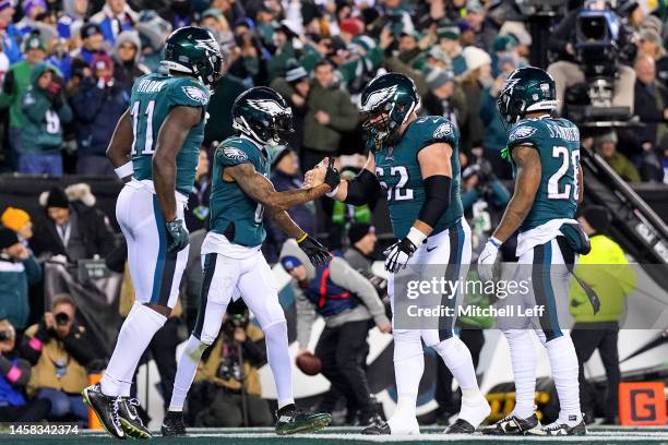 DeVonta Smith of the Philadelphia Eagles celebrates with teammates after catching a touchdown pass against the New York Giants during the first...
