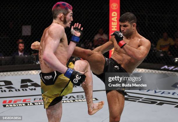 Thiago Moises of Brazil kicks Melquizael Costa of Brazil in a lightweight fight during the UFC 283 event at Jeunesse Arena on January 21, 2023 in Rio...