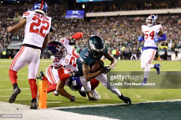 DeVonta Smith of the Philadelphia Eagles scores a touchdown against the New York Giants during the first quarter in the NFC Divisional Playoff game...