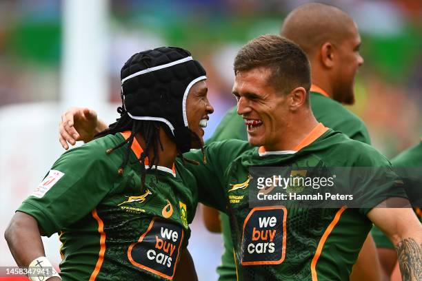 Jaiden Baron of South Africa celebrates with team mates after scoring a try during the 2023 HSBC Sevens match between South Africa and Ireland at FMG...