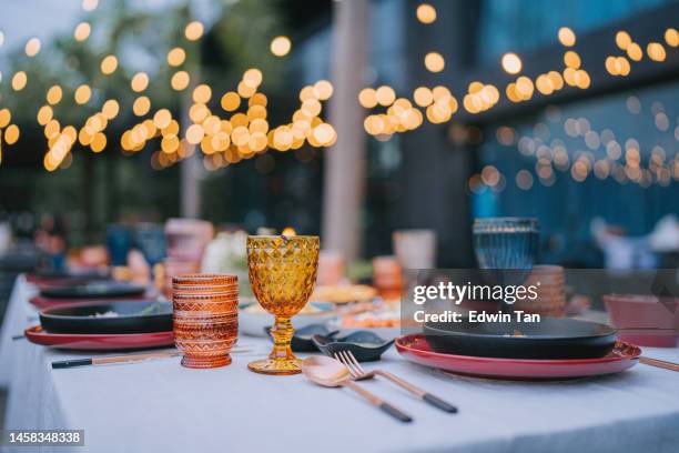 outdoor dining place setting with asian food - backyard party stock pictures, royalty-free photos & images