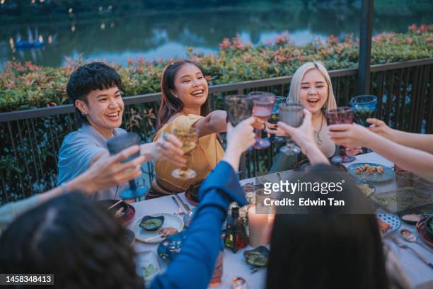 asian chinese friends celebration toast in outdoor dining - waterfront dining stock pictures, royalty-free photos & images