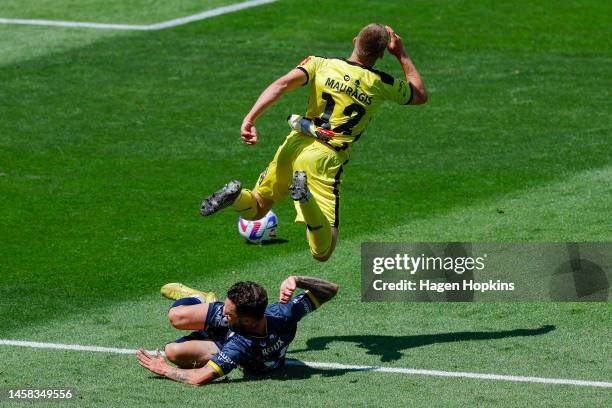 Lucas Mauragis of the Phoenix is brought down in a tackle by Storm Roux of the Mariners during the round 13 A-League Men's match between Wellington...
