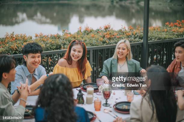 asian chinese friends outdoor dining social gathering - waterfront dining stock pictures, royalty-free photos & images