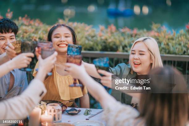 asian chinese friends celebration toasting outdoor dining - waterfront dining stock pictures, royalty-free photos & images