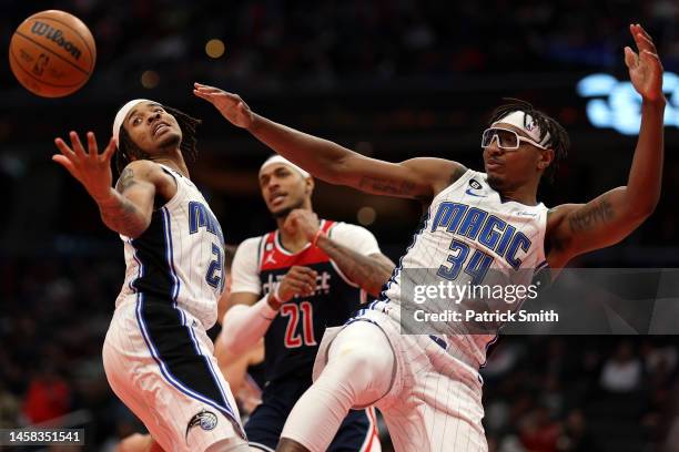 Markelle Fultz of the Orlando Magic and teammate Wendell Carter Jr. #34 try to grab a rebound in front of Daniel Gafford of the Washington Wizards...