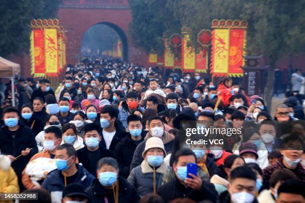 People pray and burn incense for blessing at Taihao Mausoleum Temple to celebrate the Chinese Lunar New Year on January 22, 2023 in Zhoukou, Henan...