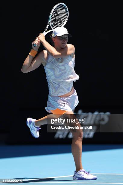 Iga Swiatek of Poland plays a backhand during the fourth round singles match against Elena Rybakina of Kazakhstan during day seven of the 2023...