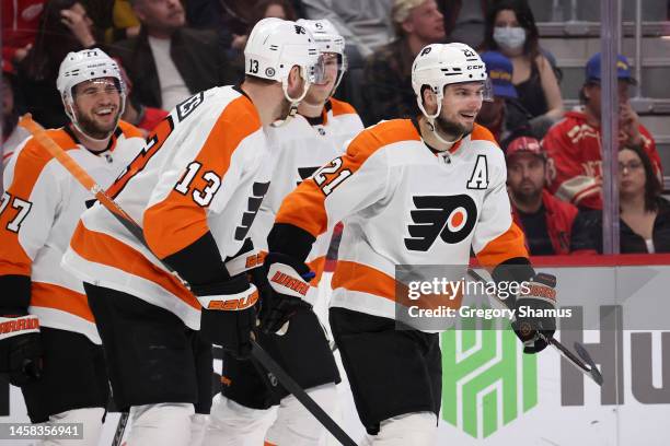 Scott Laughton of the Philadelphia Flyers celebrates his third period goal with teammates while playing the Detroit Red Wings at Little Caesars Arena...