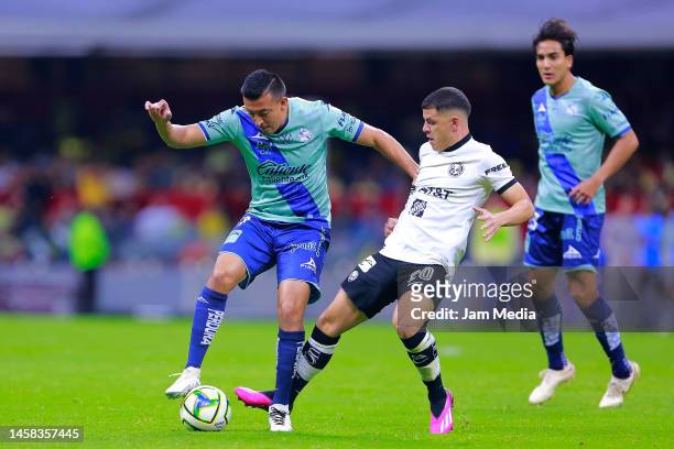 Daniel Alvarez of Puebla fights for the ball with Richard Sanchez of America during the 3rd round match between America and Puebla as part of the...