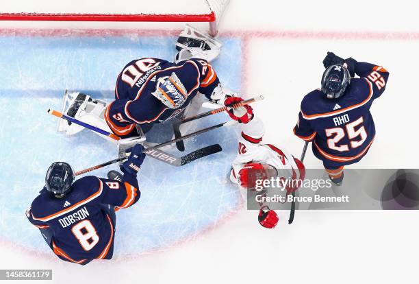 Sebastian Aho of the Carolina Hurricanes scores a second period goal against Ilya Sorokin of the New York Islanders at UBS Arena on January 21, 2023...