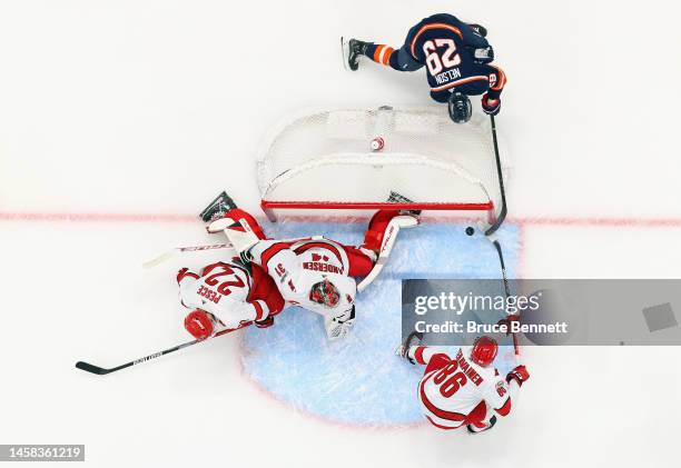 Brock Nelson of the New York Islanders scores a first period goal against Frederik Andersen of the Carolina Hurricanes at UBS Arena on January 21,...