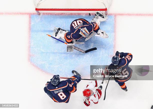 Sebastian Aho of the Carolina Hurricanes scores a second period goal against Ilya Sorokin of the New York Islanders at UBS Arena on January 21, 2023...