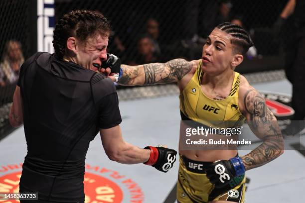 Jessica Andrade of Brazil punches Lauren Murphy in a flyweight fight during the UFC 283 event at Jeunesse Arena on January 21, 2023 in Rio de...